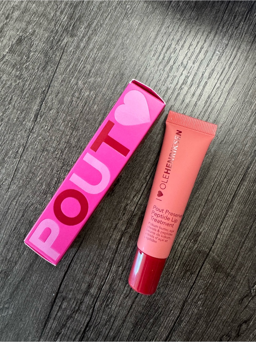 Ole Henriksen Pout Preserve Lip Treatment - Bright Pink Tube with Red Cap